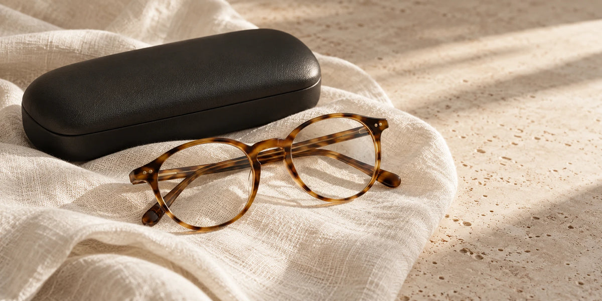 Eyewear and a case on a travertine surface in an AVENOR editorial
